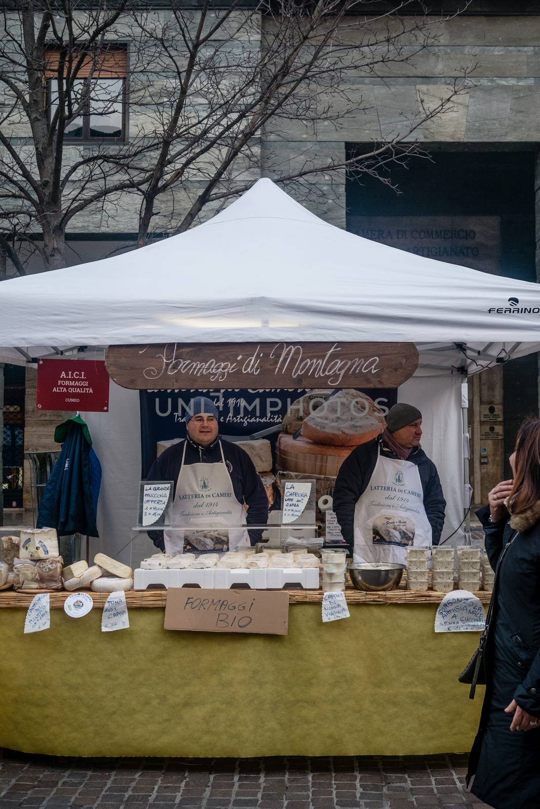 Mountain cheese vendor and maker, street market in Cremona, Lombardy, Italy, january 24th 2016.