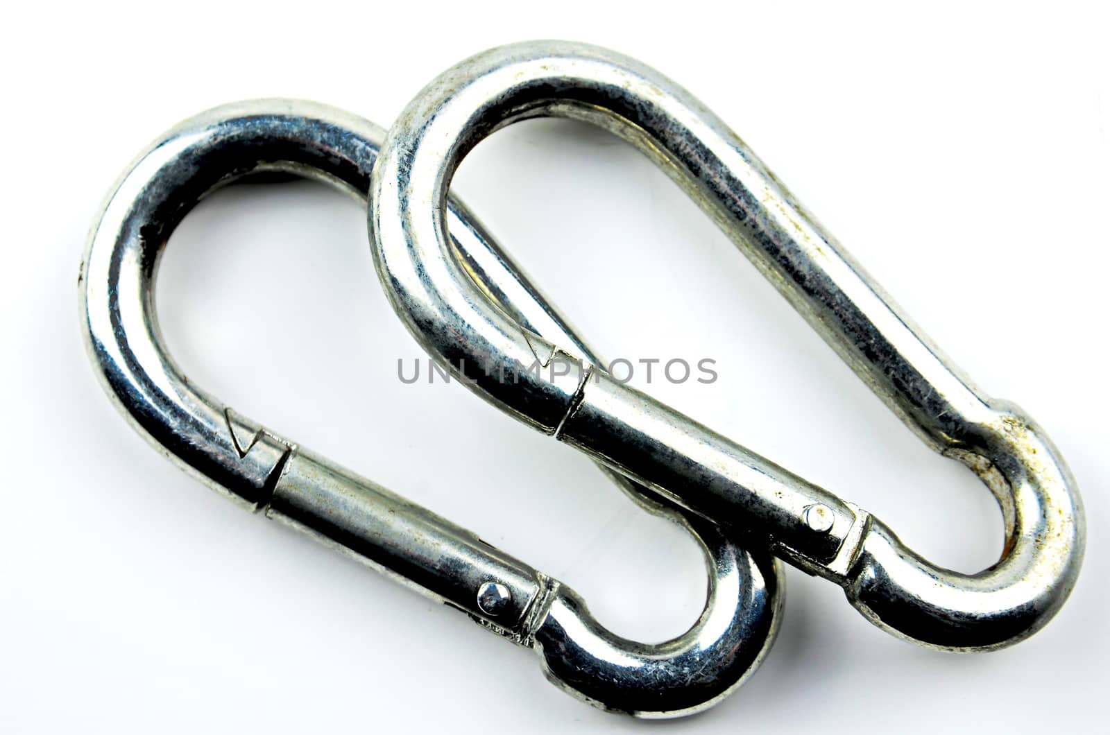 Two silver carabiner on white background
