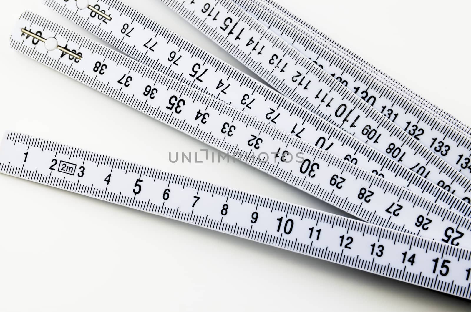 Plastic folding yardstick, ruler on white background
