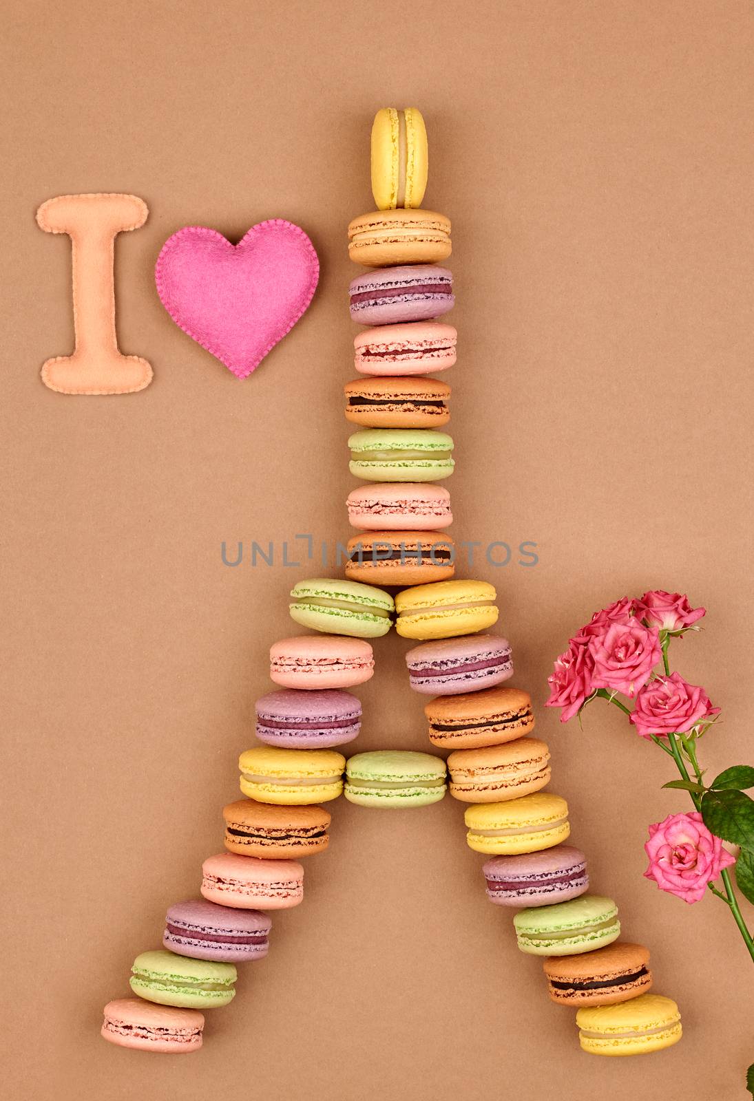 Macarons. I love Eiffel Tower french sweet colorful, pink heart and roses. A lot of fresh  pastel delicious biscuit dessert on chocolate retro vintage background.                                           