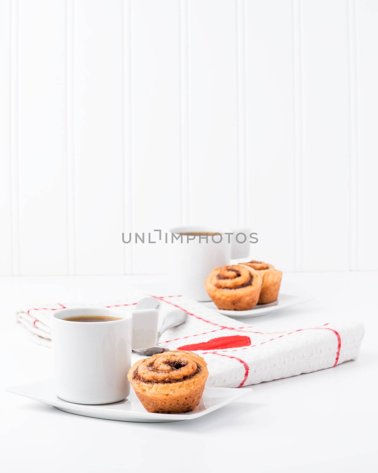 Fresh baked cinnamon rolls served with coffee.