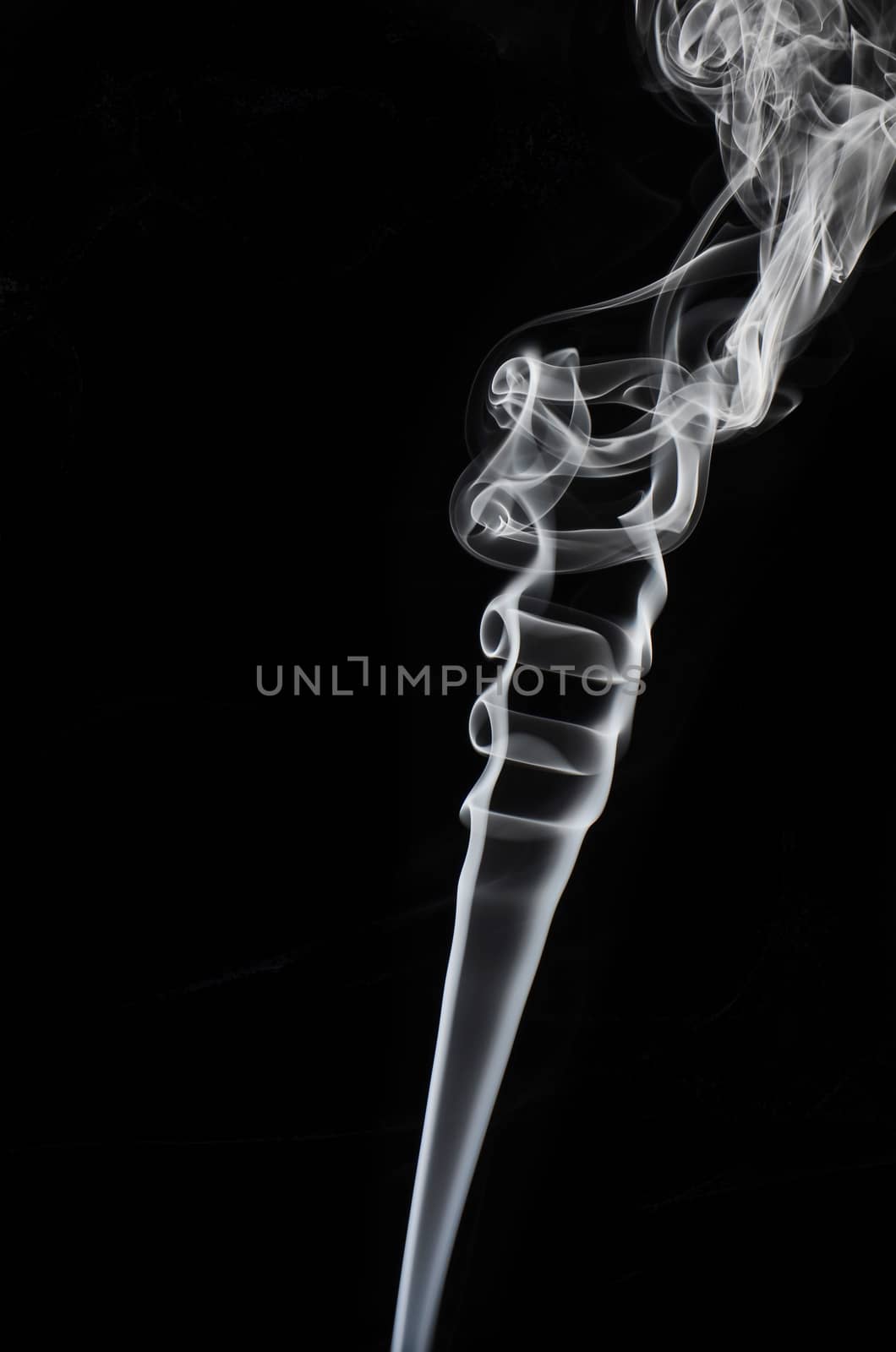 Smoke swirling on black background
