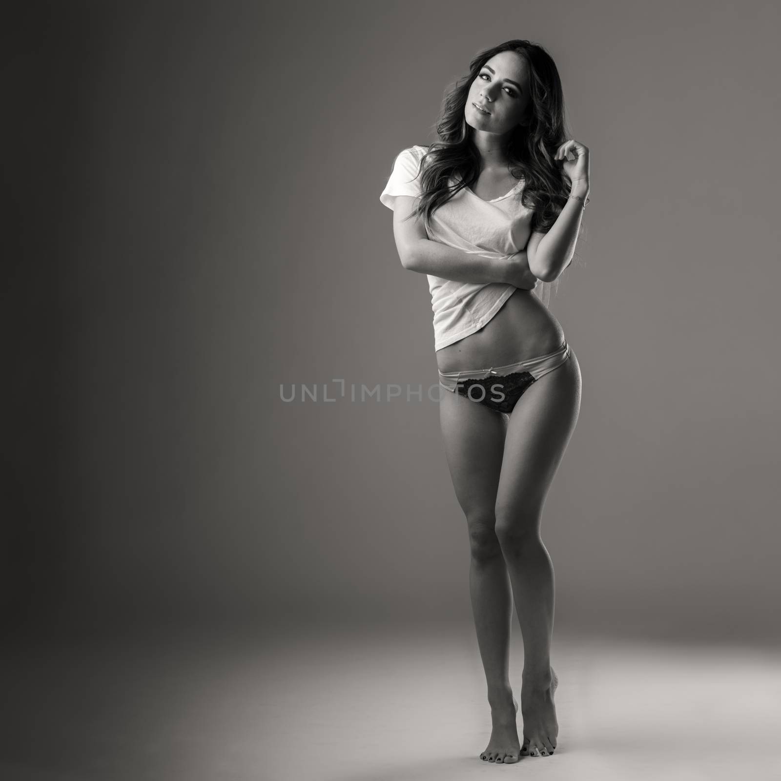 Beautiful young woman in underwear and tshirt by CelsoDiniz