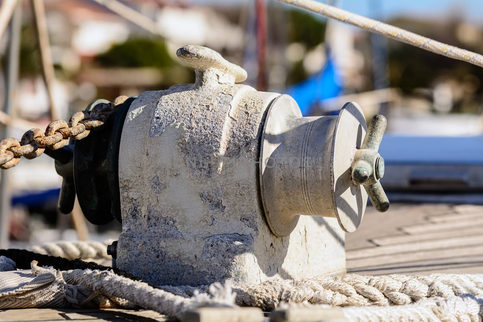 Fragmentary view details of knots and ropes on the yacht moored in the dock. Anchor Windlass Yacht
