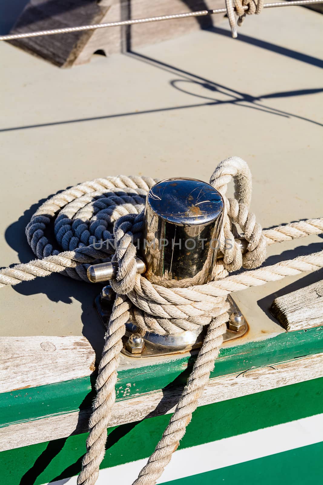 Fragmentary view details of knots and ropes on the yacht moored in the dock