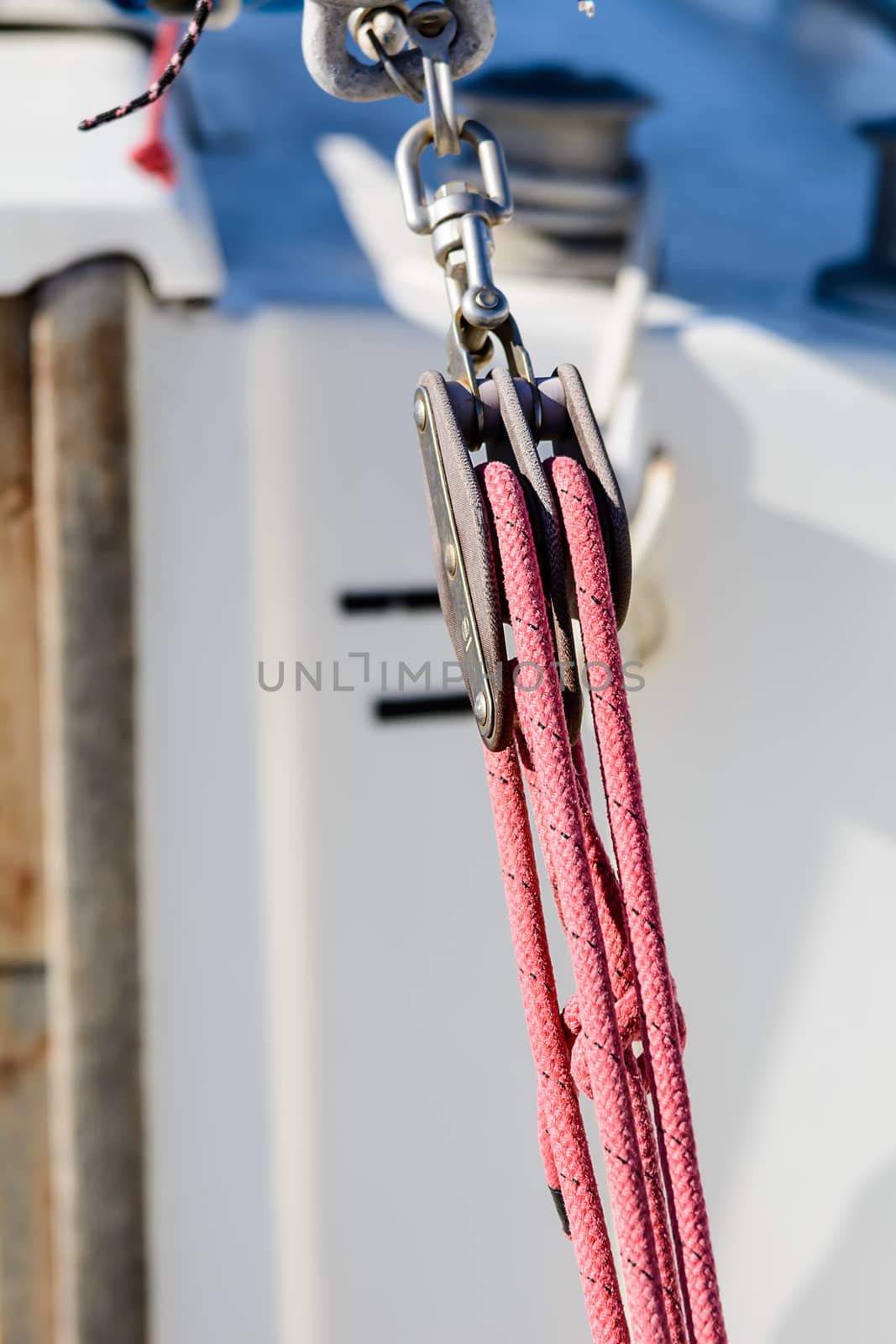 Fragmentary view details of knots and ropes on the yacht moored in the dock