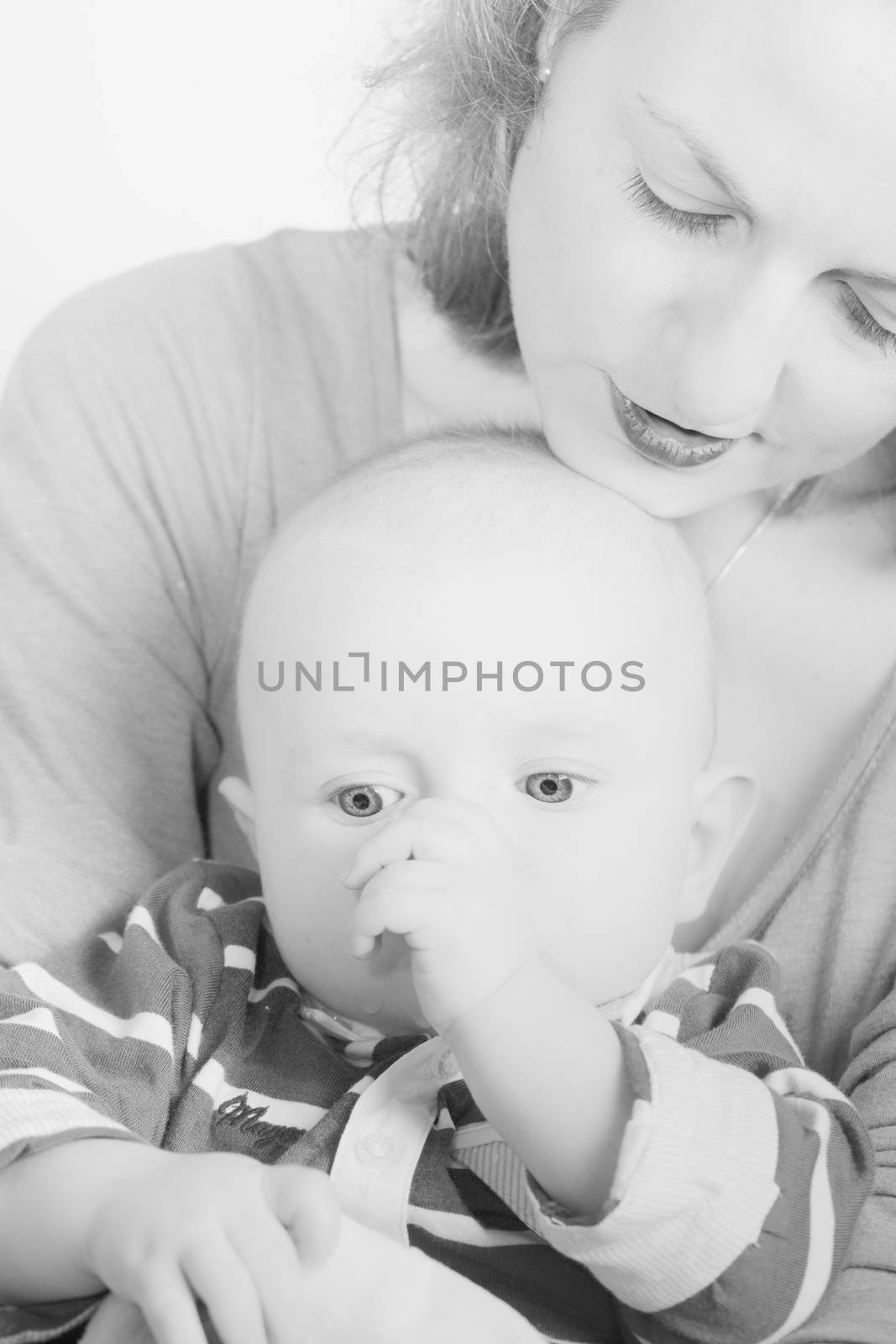 Beautiful newborn baby boy with his mother, complicity, happiness, black and white