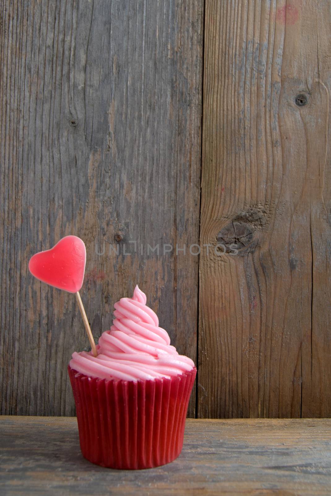 Pink cupcake with candy heart by unikpix