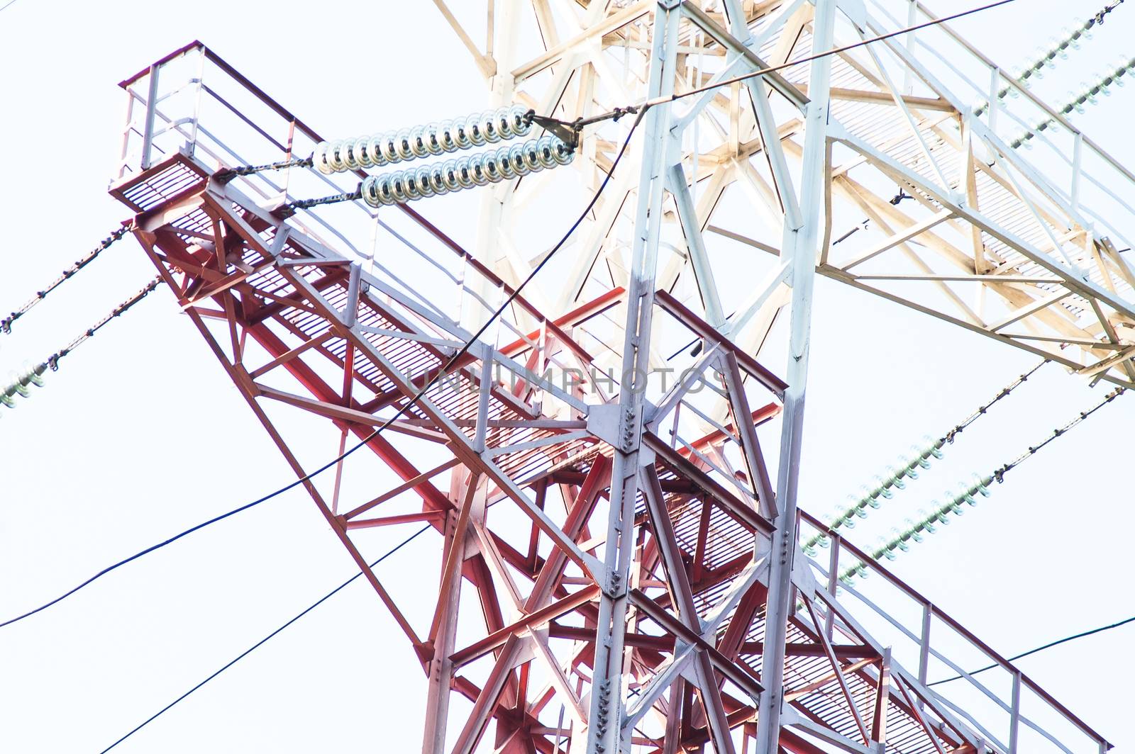 High-voltage power lines against the sky