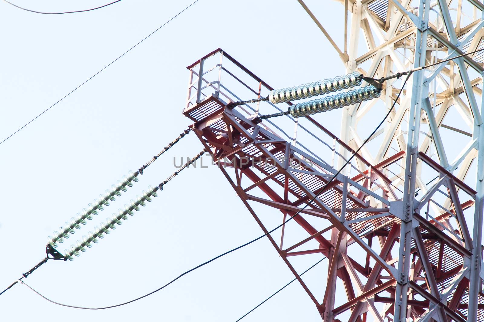 High-voltage power lines against the sky