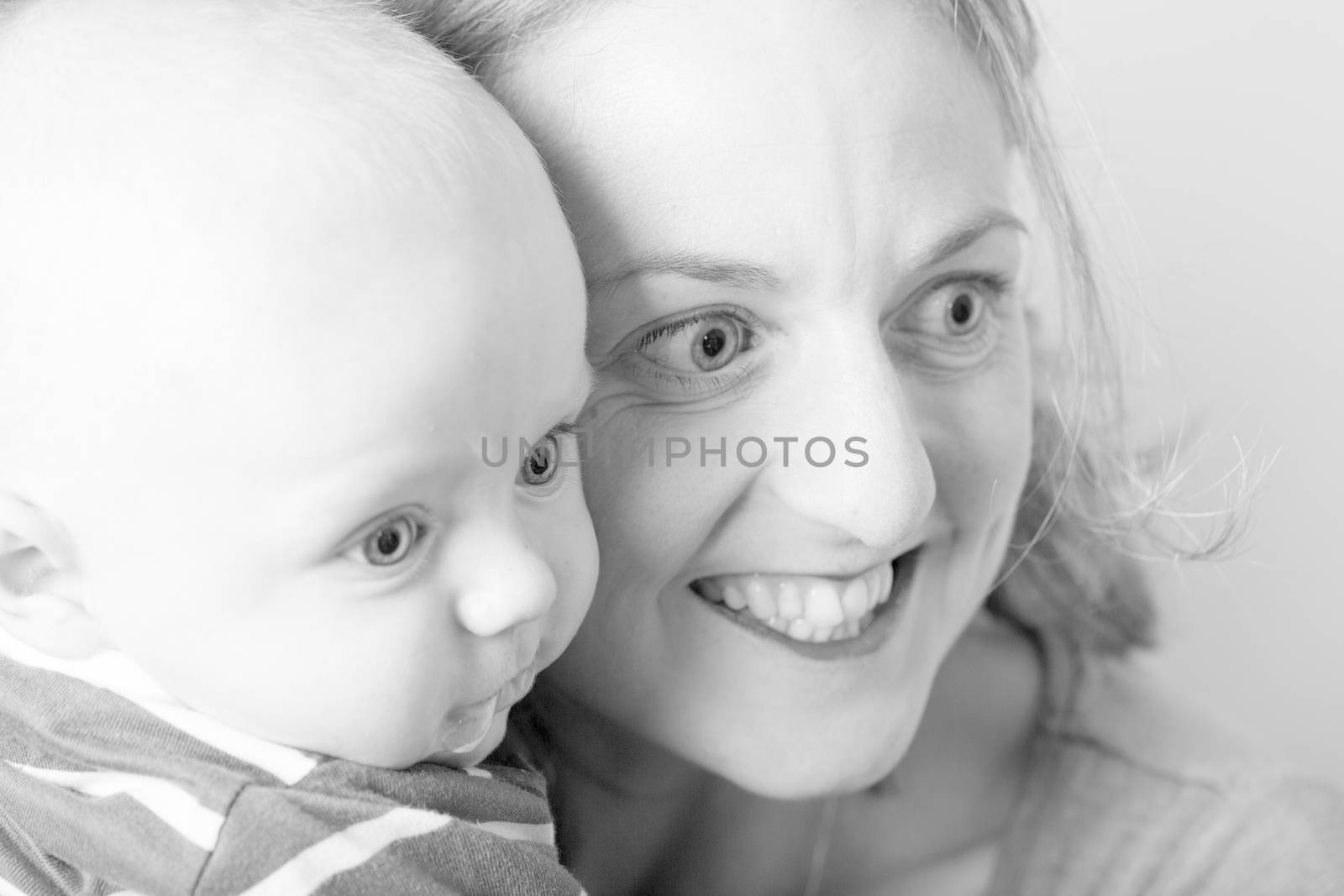 Beautiful newborn baby with his mother by CatherineL-Prod