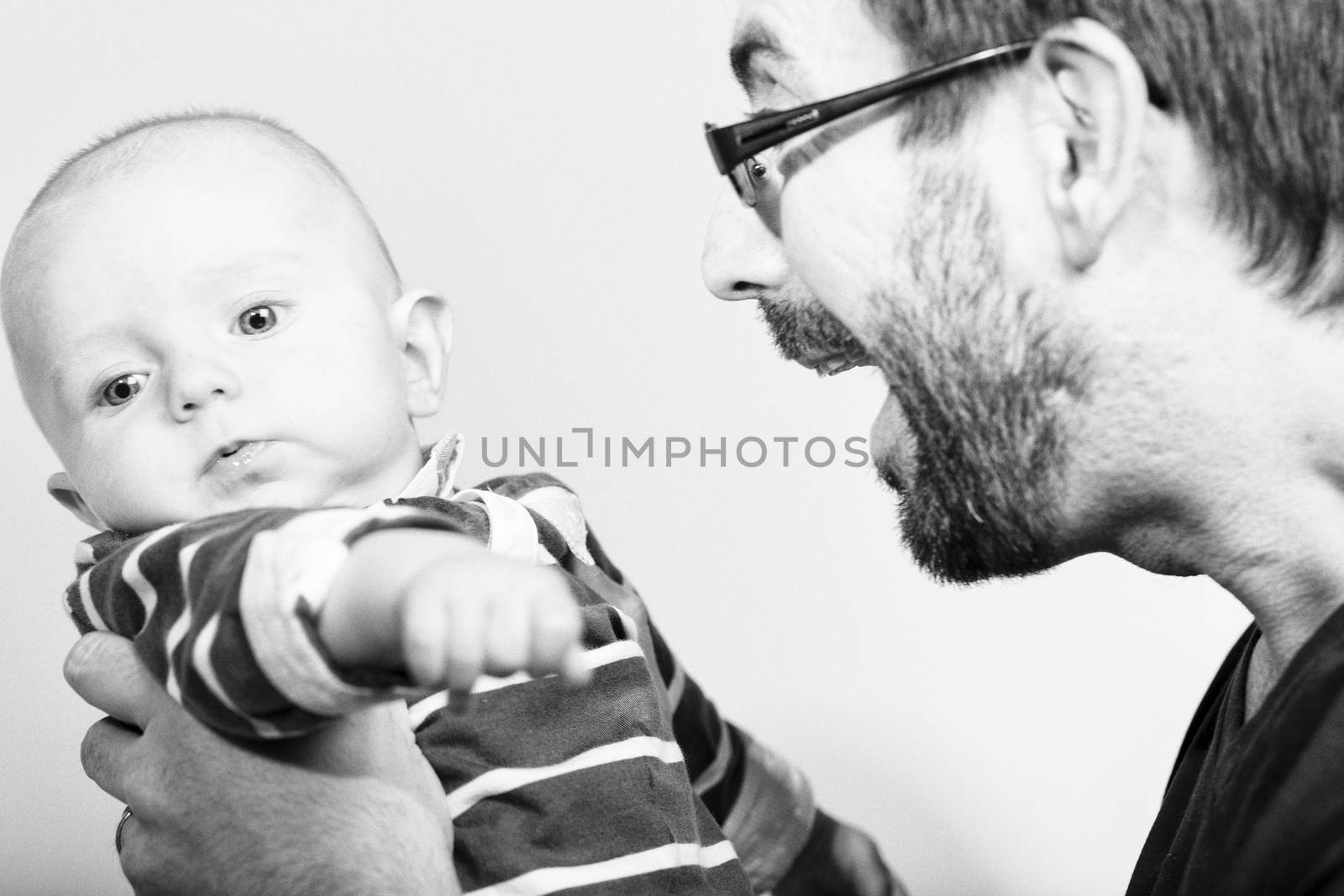 Happy and smiling portrait of Young Parents With Their Baby boy 4 month old Concept happy family