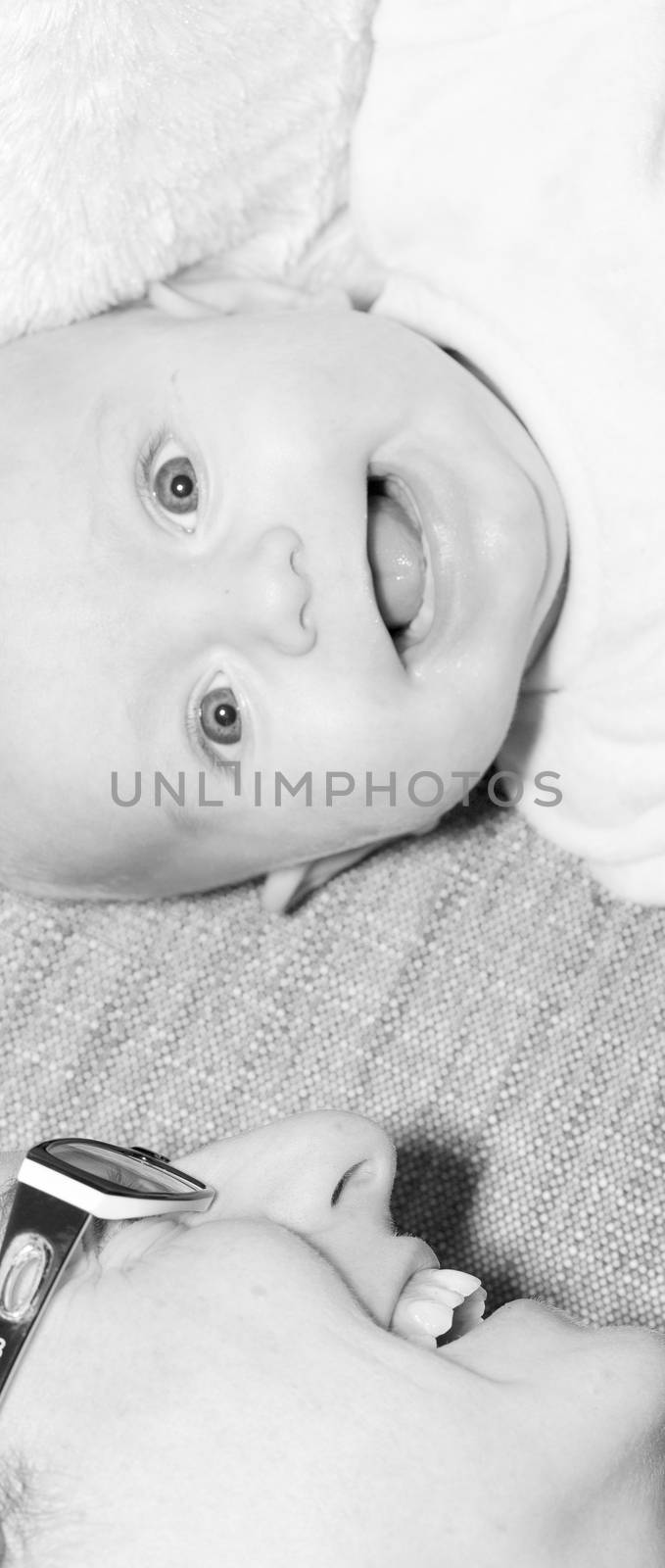 Beautiful newborn baby boy with his mother, complicity, happiness, black and white