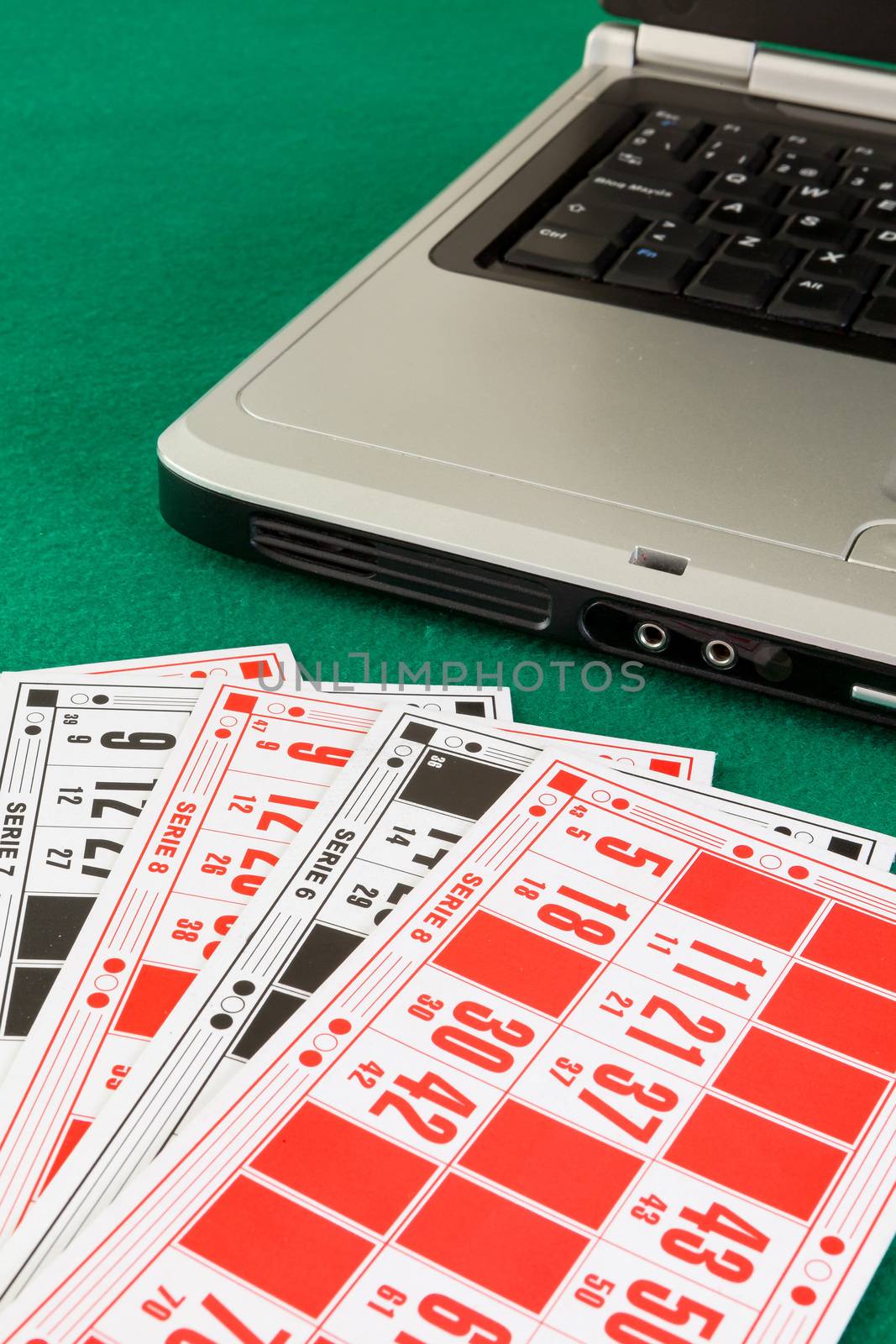 Bingo cards and a laptop by andongob