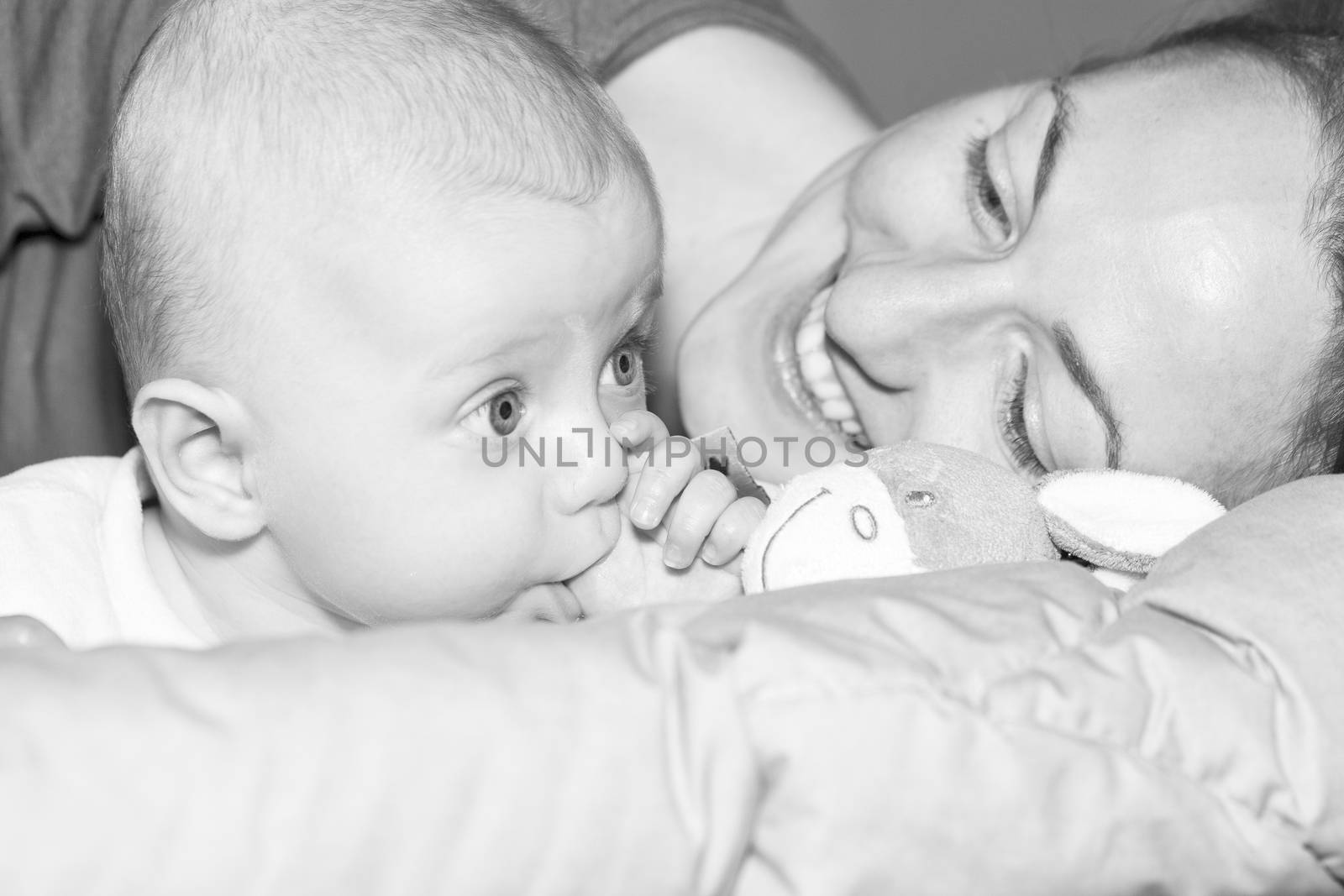 Beautiful newborn baby with his mother  by CatherineL-Prod
