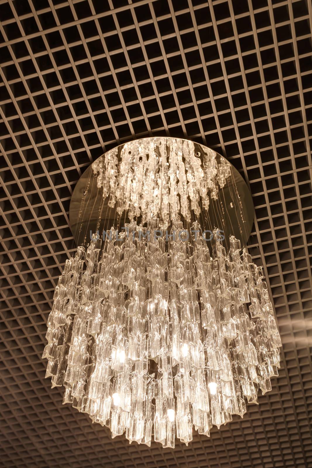 the stylish magnificent chandelier weighing on a ceiling