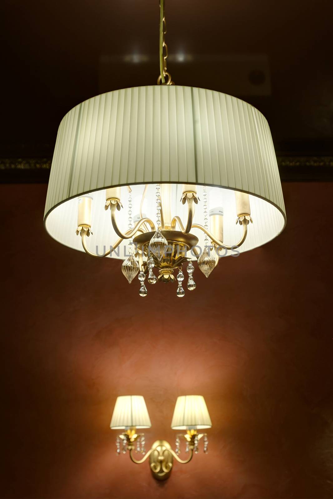 the stylish magnificent chandelier weighing on a ceiling