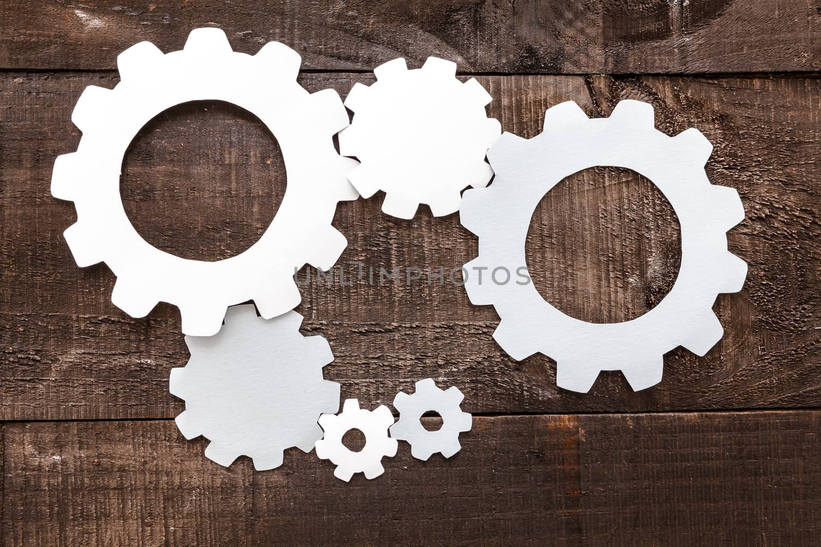 Photo illustration showing the business concept of engineering applied to industries or internet with gears