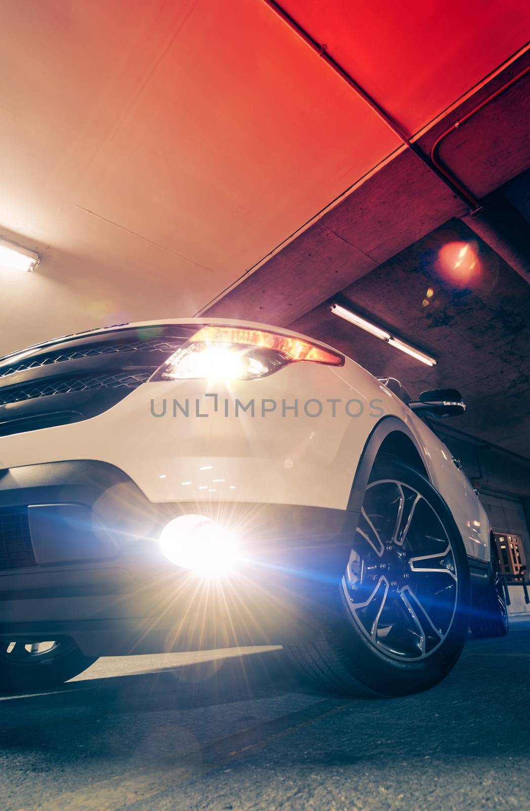 Sport Utility Vehicle on the Parking at Night. SUV Car Vertical Photo.