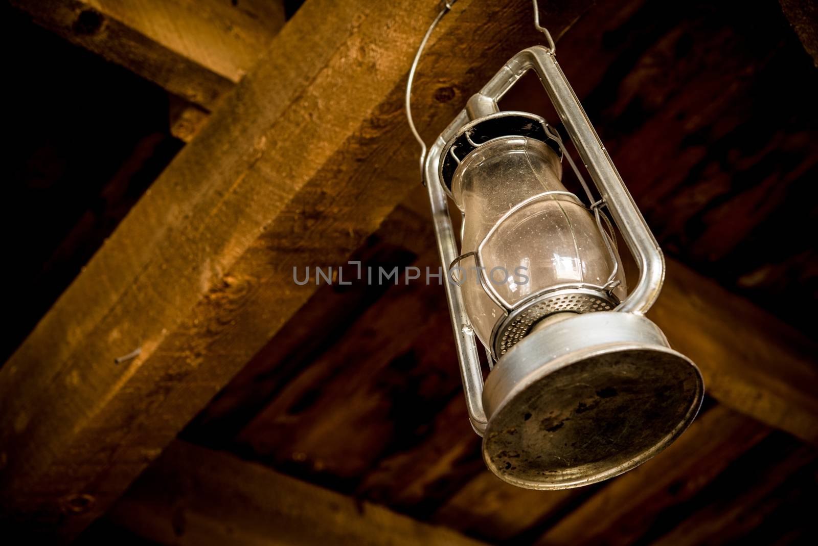 Oil Lamp Hanged in the Wooden Barn. Vintage Lantern Closeup.