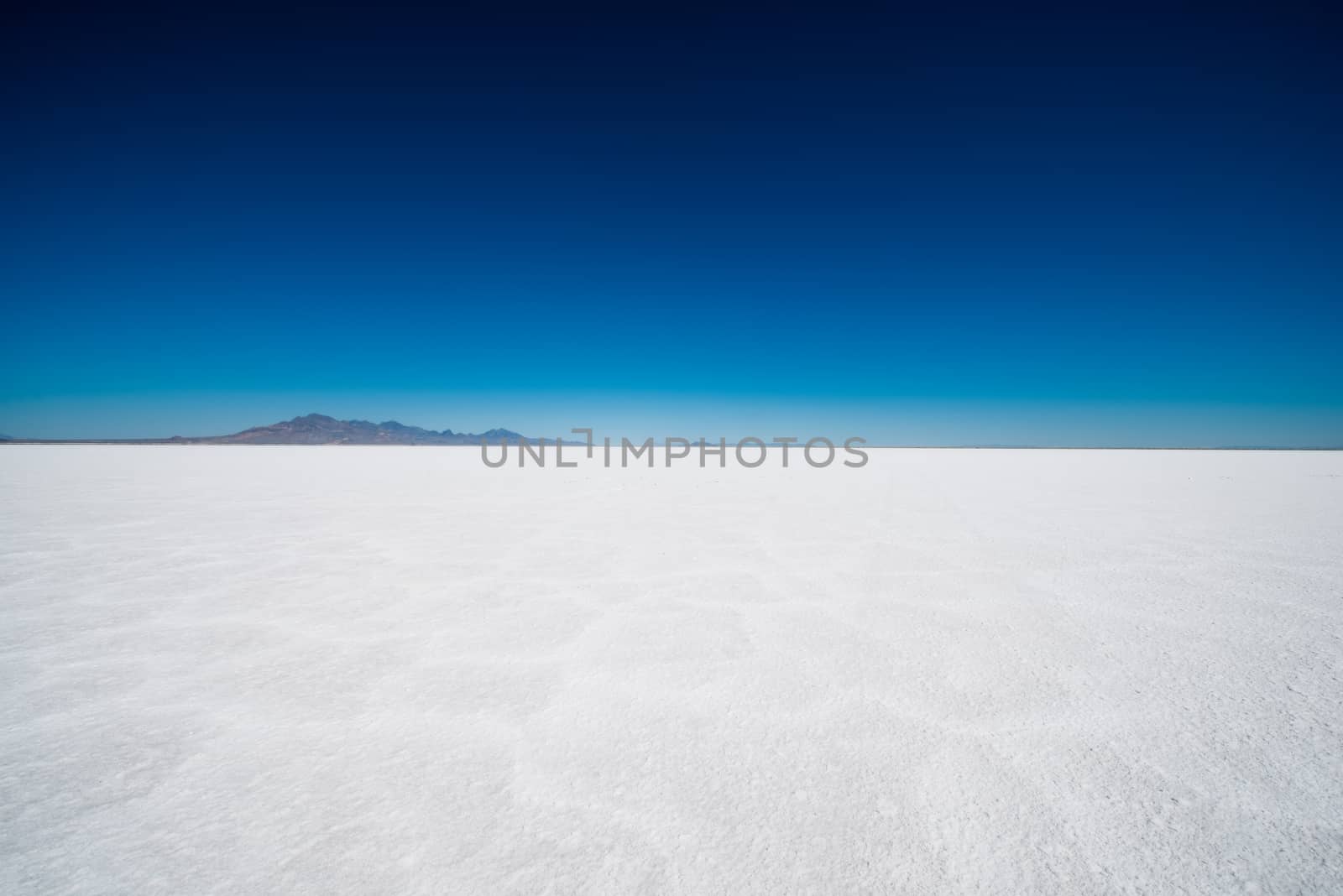 Salt Flats in Utah. Salt Flats Landscape. Dark Blue Sky and Snow White Salt Soil. Boneville near Salt Lake City, Utah, United States. Bonneville Salt Flats