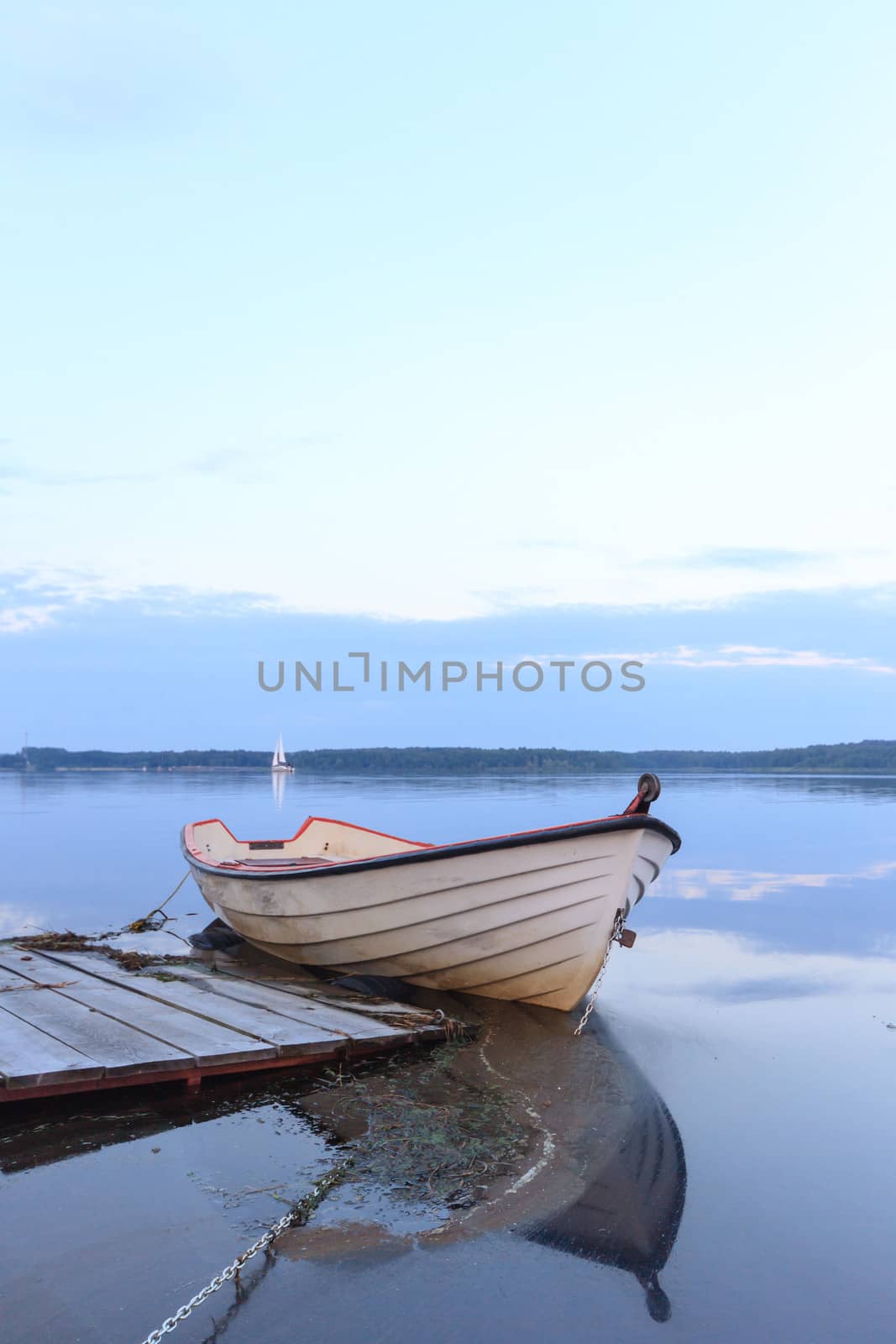 boat on the blue lake with cloudy sky, nature series
