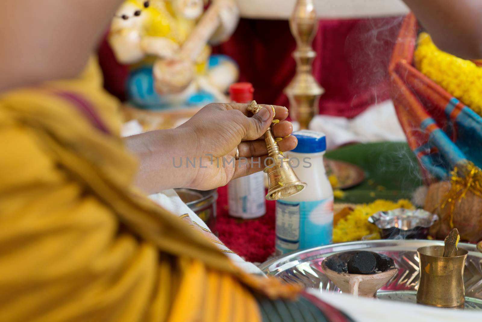 Traditional Indian Hindus ear piercing ceremony. Focus on the hand. India special rituals.