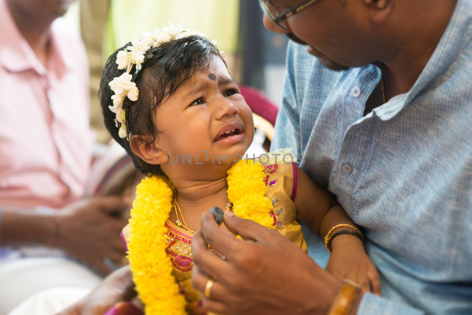 Baby girl prepared for the karnvedh events. Traditional Indian Hindus ear piercing ceremony. India special rituals.