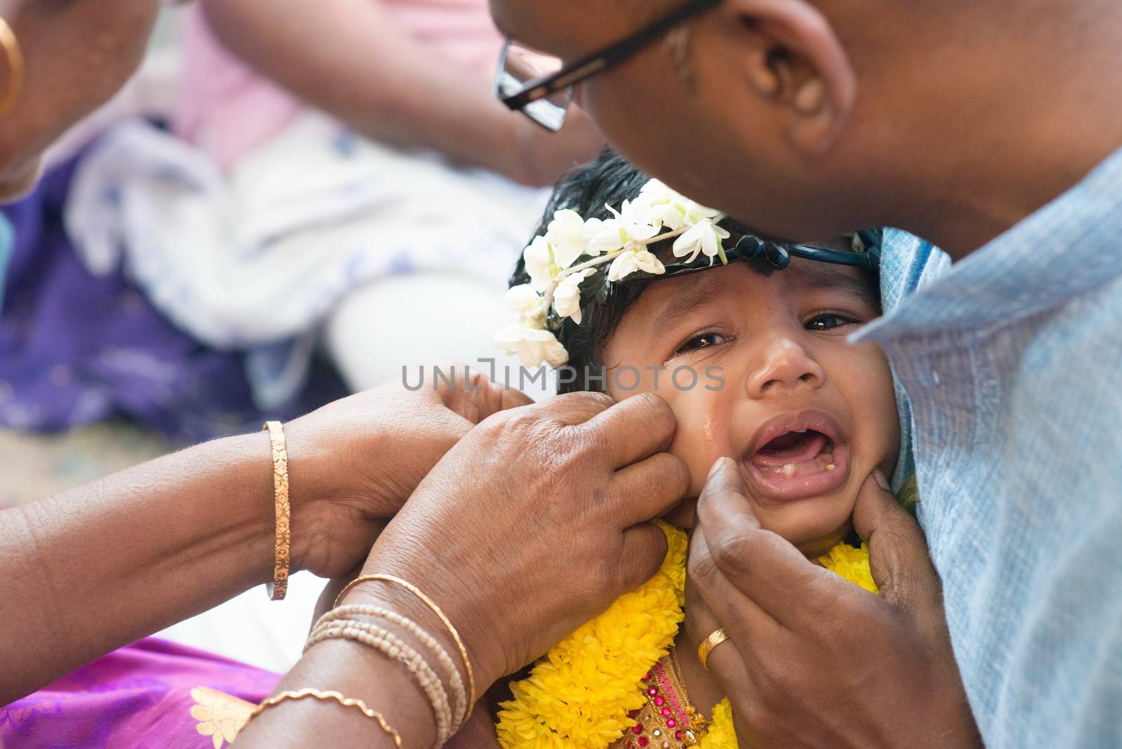 Baby girl crying in Hindus ear piercing ceremony by szefei