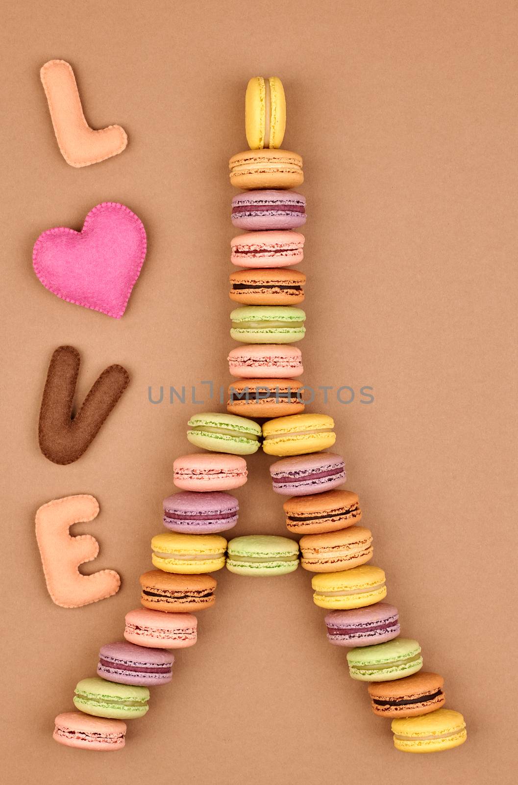 Macarons. Still life. Eiffel Tower french sweet colorful, Word Love heart. Fresh pastel delicious biscuit dessert on chocolate retro vintage background.                                           