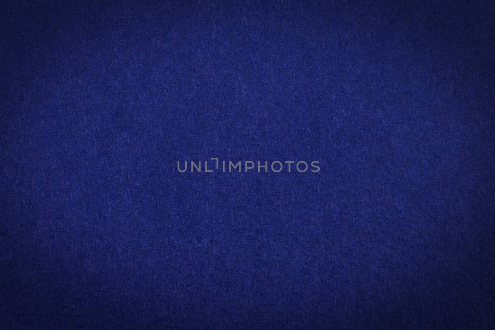 Dark blue paper with vignette, a background or texture