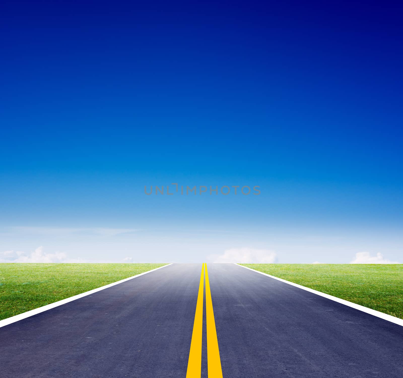 Highway road with green grass and bluesky