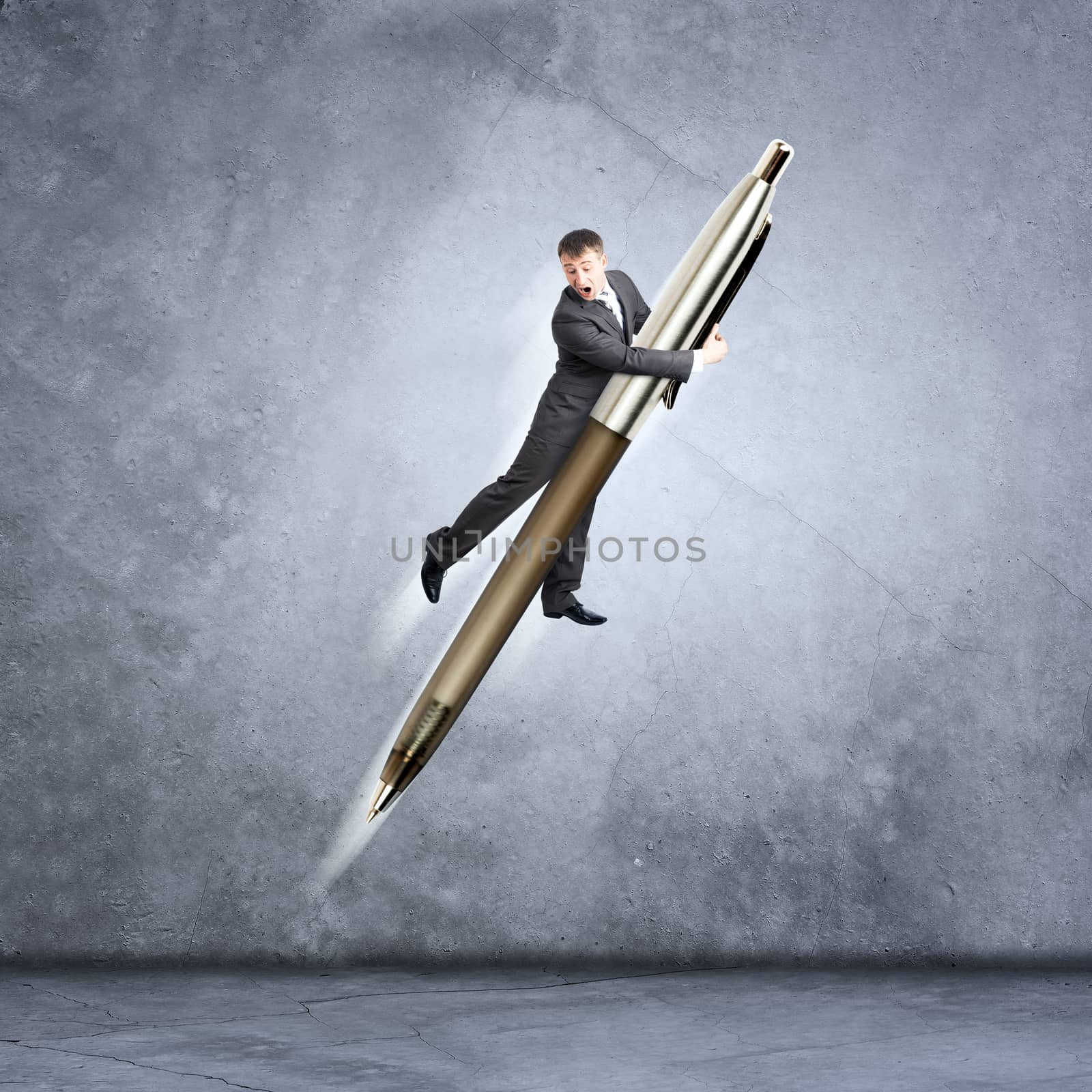 Businessman flying on big pen on grey wall background
