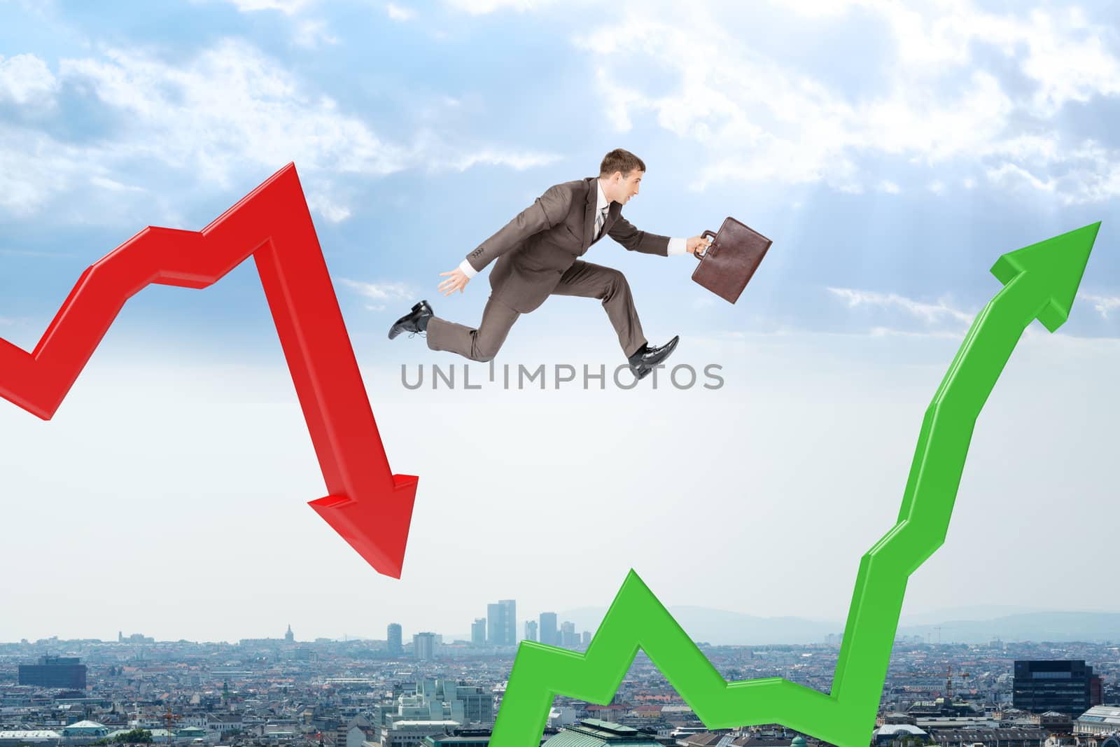 Businessman hopping arrows with suitcase above cityscape