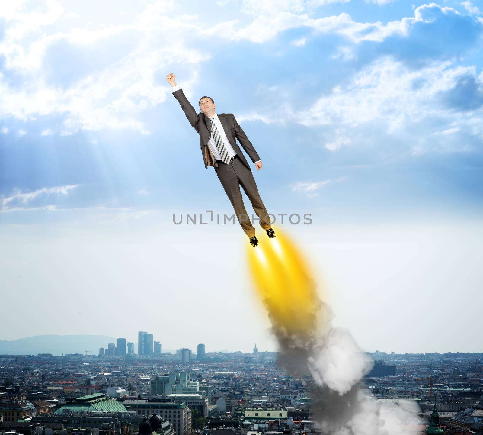 Businessman like superman flying above city scape