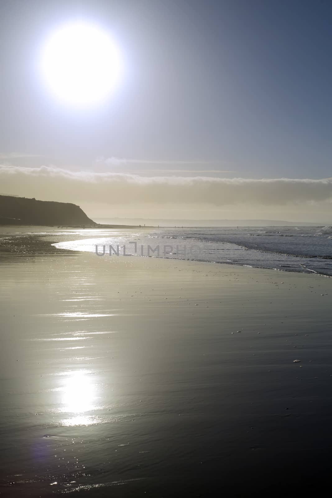 distant cliffs on a sunset beach in county Kerry Ireland