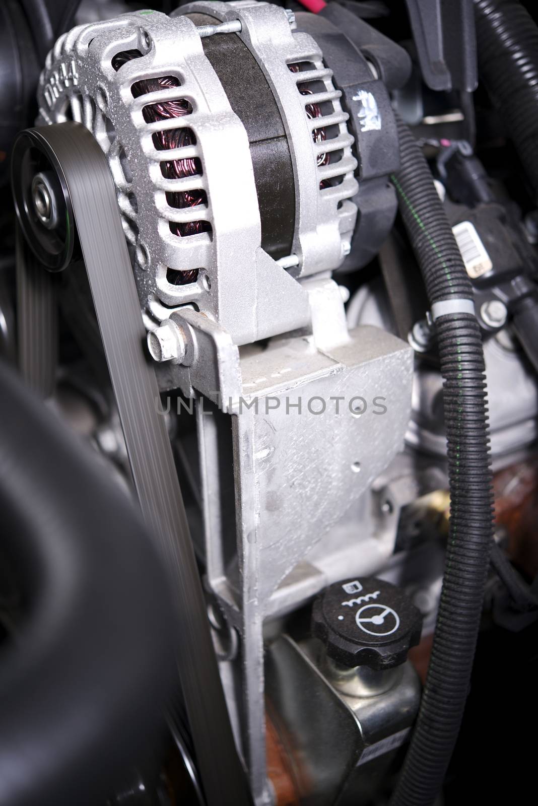 Alternator Elements in a Modern Car. Alternator and the Car Engine.