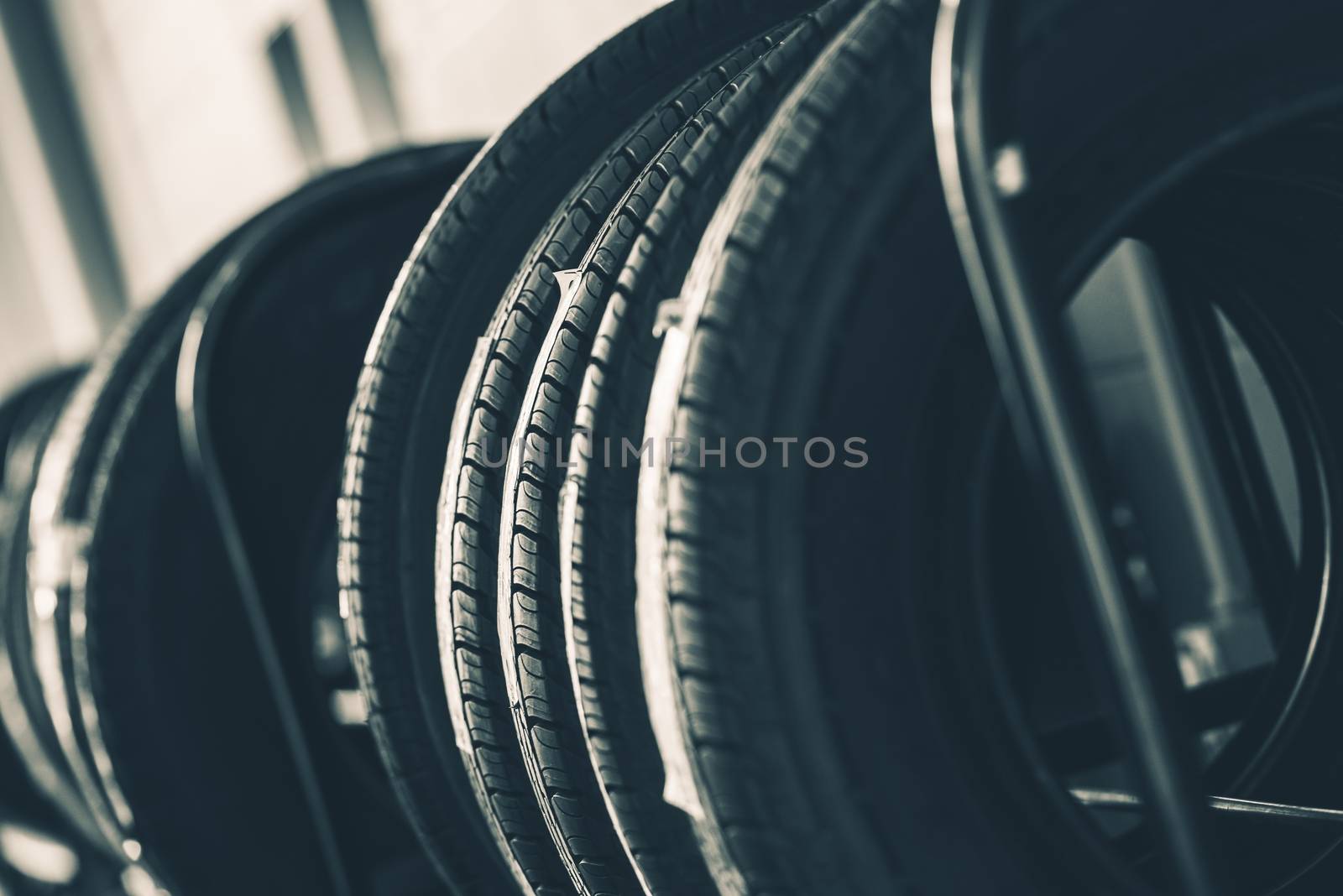 Brand New Tires Rack Closeup Photo. Car Tires Market