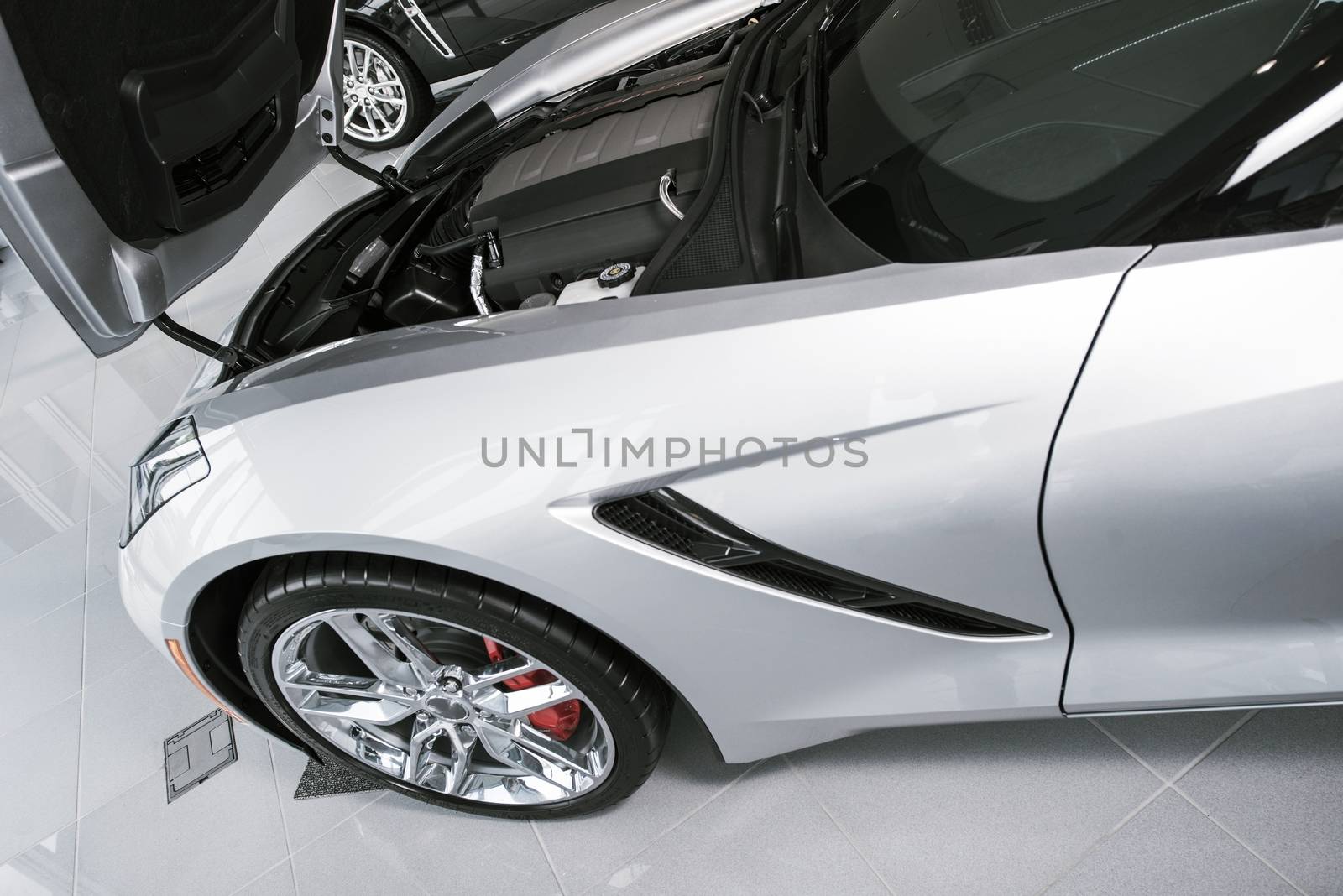 Brand New Silver Super Car For Sale Waiting For New Owner at Dealership. Cars Market Theme.