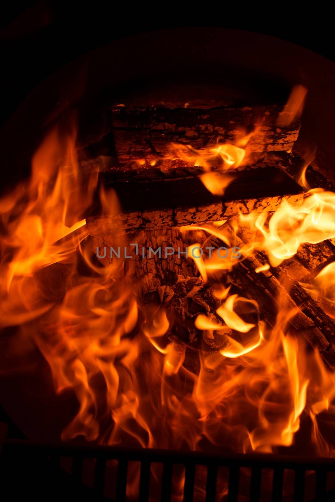 Fireplace Flames in the Dark. Fireplace Closeup.