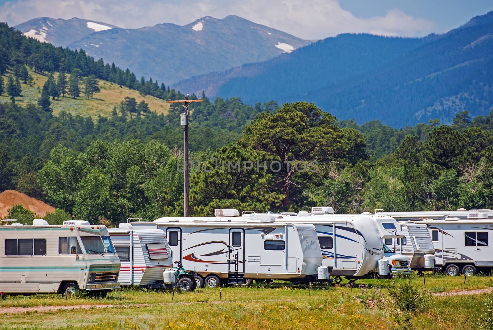 Mountain RV Park with Travel Trailers and Motorhomes. Recreational Vehicles.