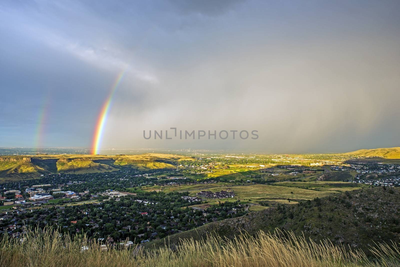 Denver Metro Rainbow. Beautiful Double Rainbow Above Golden, Colorado with Thunderstorm in a Distance. 