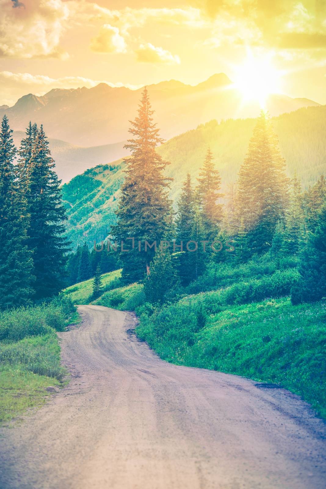 Scenic Mountain Road. Gravel Road Through Wonderful Colorado Landscape Scenery. Dream Road. Colorful Color Grading.