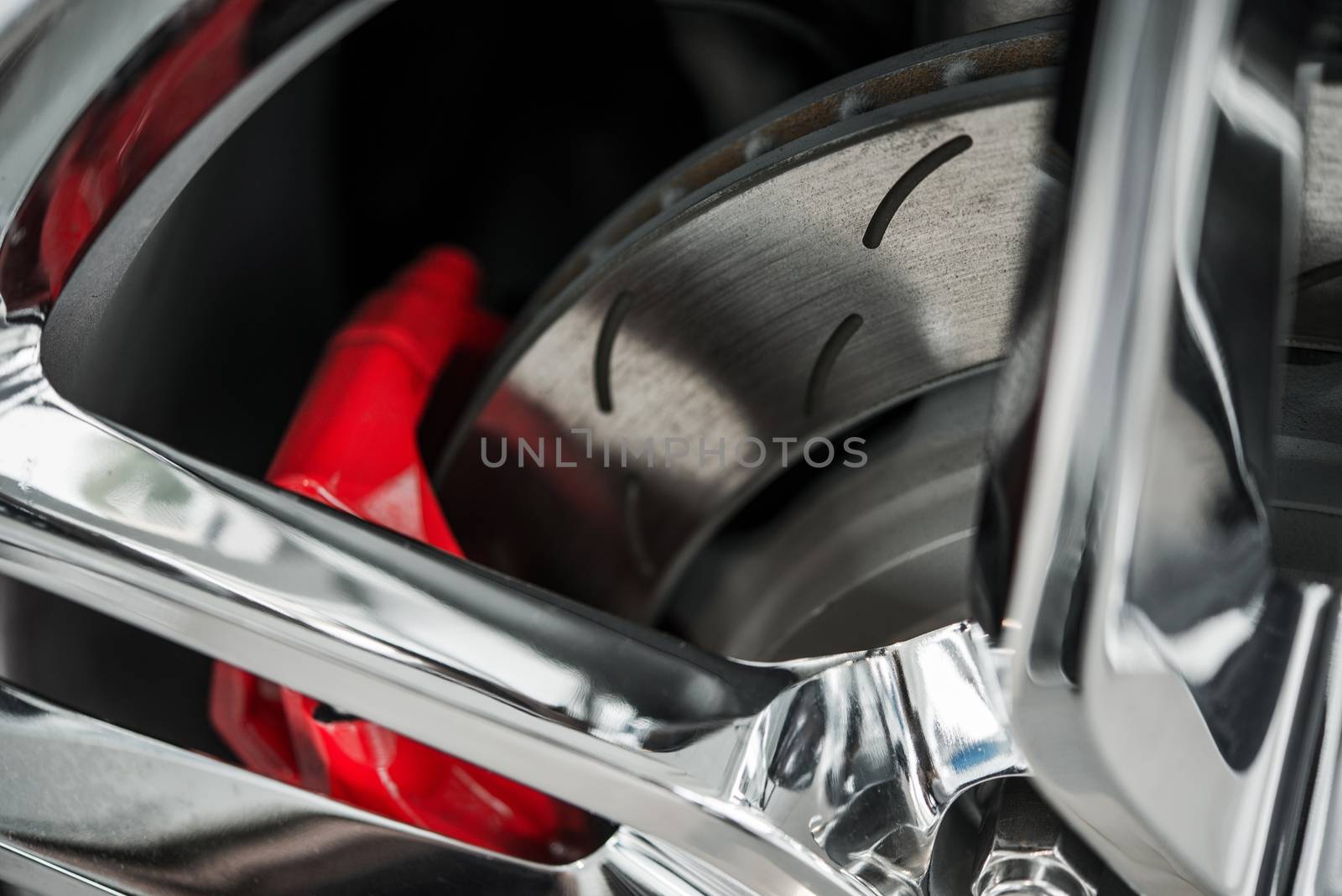 Super Car Brakes. Disc Brake. Disc Pads, Wheel Bearing, Caliper Assembly. Car Brakes Closeup Photo.