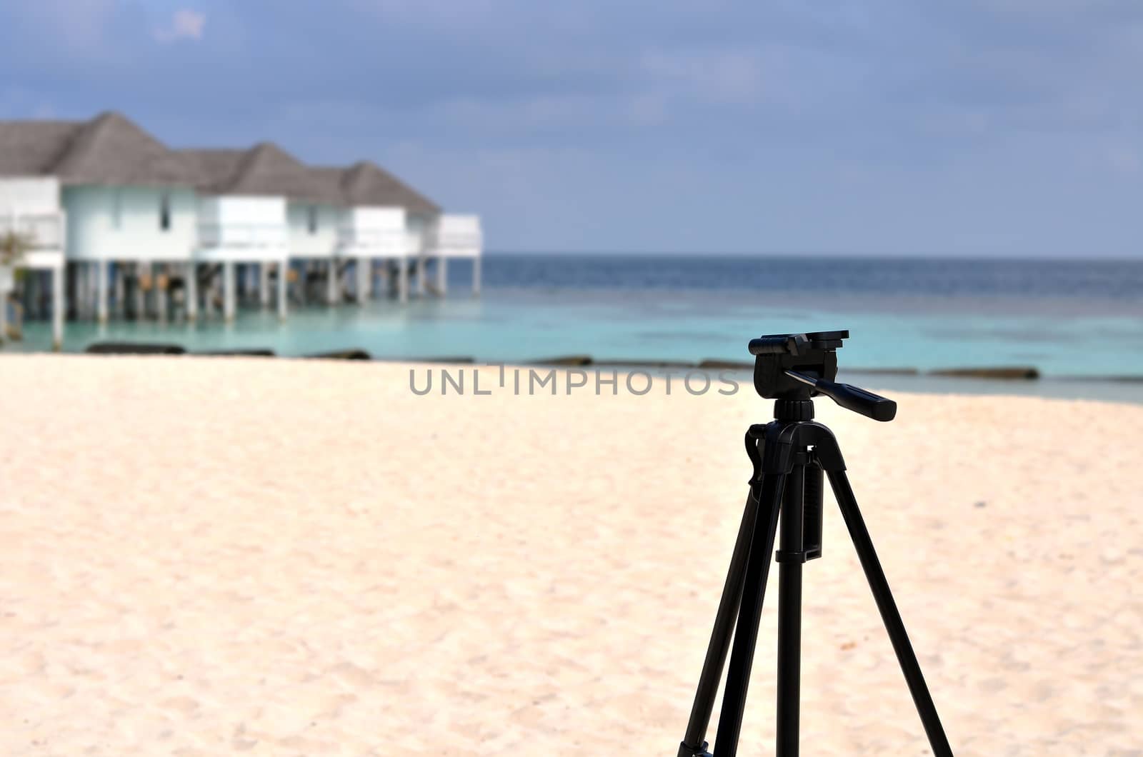 Tripod standing on maldives beach, equipment of couple lover travel, Maldives