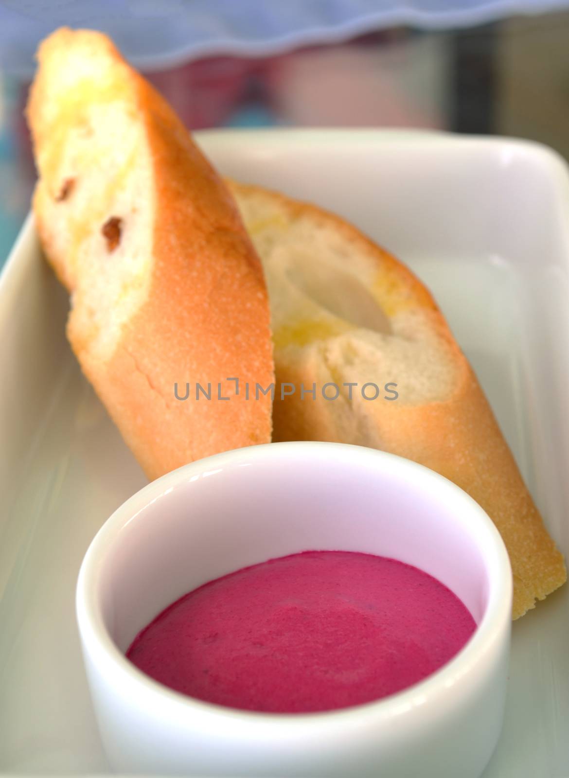 homemade pink jam with bread; breakfast meal