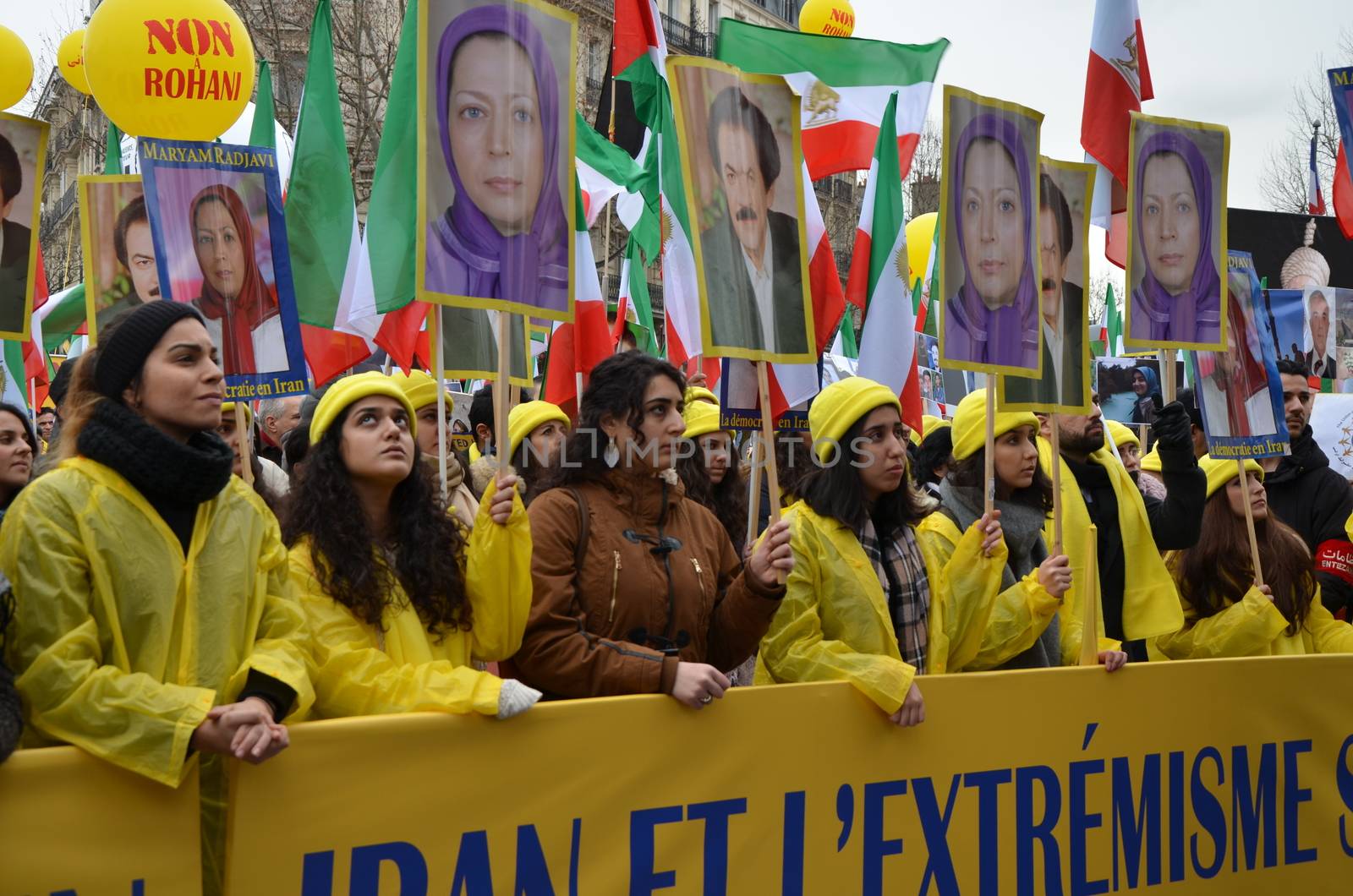 FRANCE, Paris: People raise signs with portrait of Iranian political opponent Maryam Radjavi as they take part in a demonstration denouncing Iran's use of the death penalty, on the occasion of the official visit to France by the Iranian President on January 28, 2016 in Paris at Denfert-Rochereau square. Iranian President Hassan Rouhani begun an official visit to France on January 27, 2016 which is expected to include the signing of an agreement to buy more than 100 planes following talks with President Francois Hollande.
