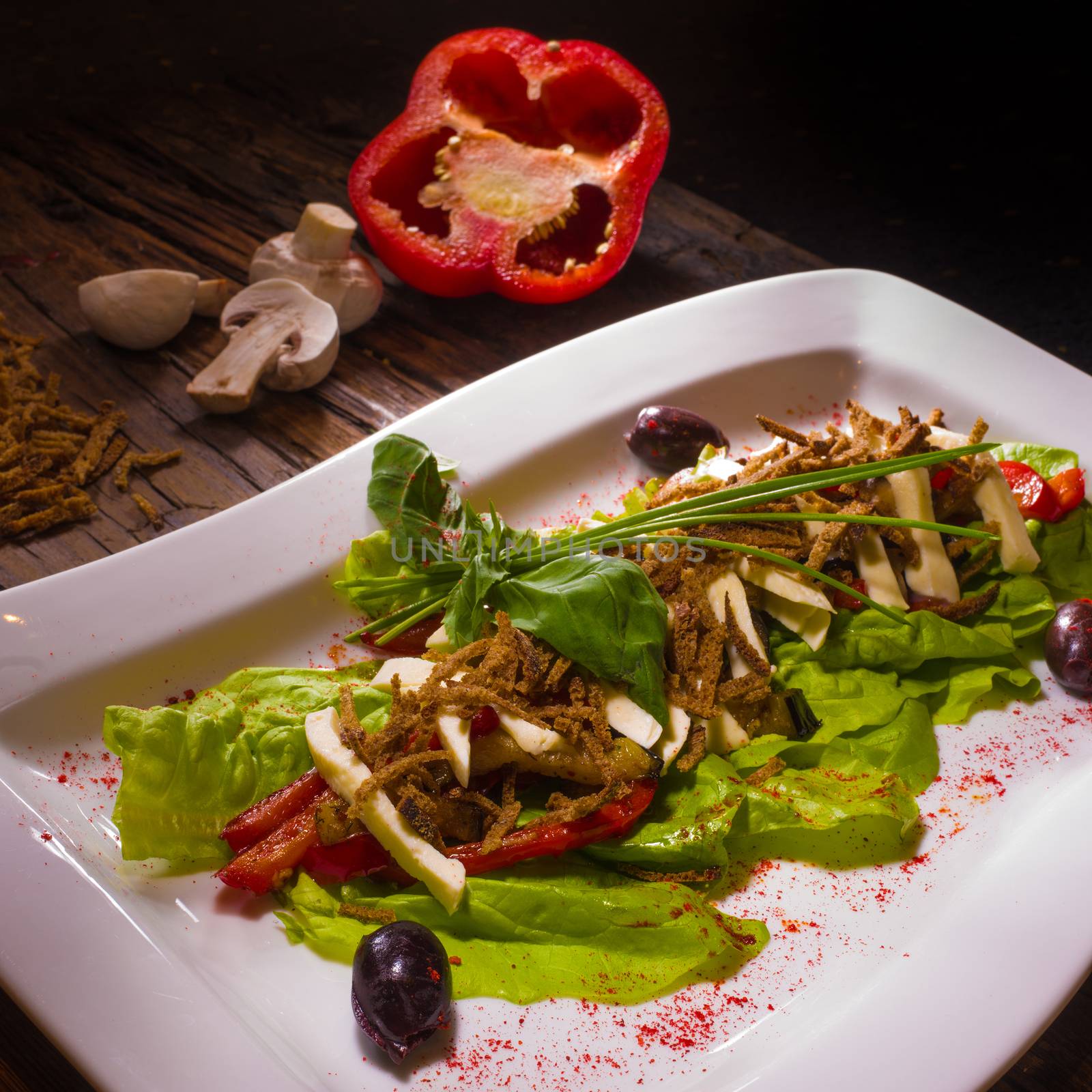 Salad from aubergine,mozzarella and tomato with basil.  by sarymsakov