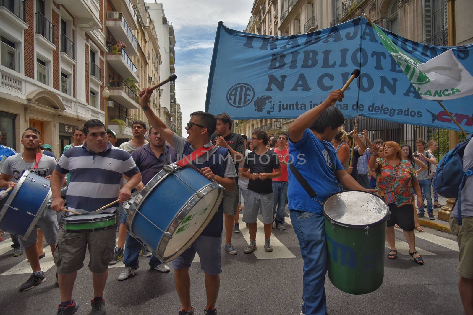 ARGENTINA, Buenos Aires: Demonstrators march through the streets of Buenos Aires on January 28, 2016, protesting the dismissal of Ministry of Culture employees.State workers received news of layoffs in various public agencies. 
