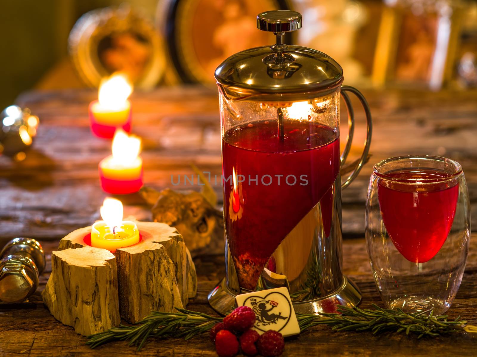 Red herbal and fruit tea in cup and tea pot